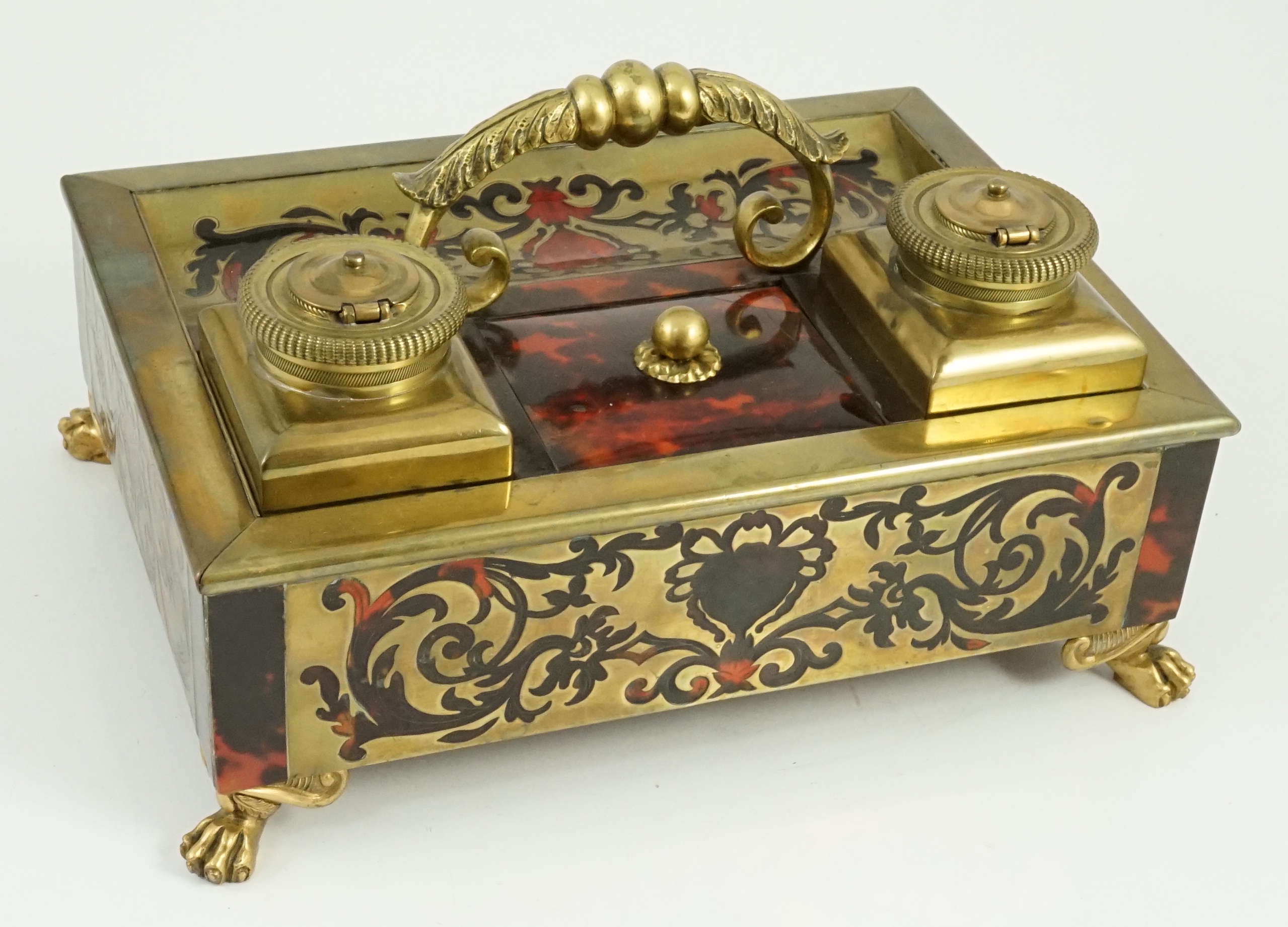 A 19th century Louis XIV style red boulle inkstand, 25cm wide, 18cm deep, 13cm high